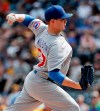 FILE - In this Aug. 19, 2018, file photo, Chicago Cubs relief pitcher Justin Wilson throws against the Pittsburgh Pirates in a baseball gam in Pittsburgh. A person familiar with the negotiations tells The Associated Press that left-hander Wilson and the New York Mets have agreed to a $10 million, two-year contract. The person spoke on condition of anonymity Friday, Jan. 25, 2019, because the agreement was subject to a successful physical. (AP Photo/Keith Srakocic, File)