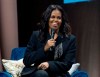 FILE - In this Nov. 17, 2018 file photo, former first lady Michelle Obama speaks to the crowd as she presents her anticipated memoir 