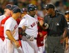 FILE - In this Aug. 17, 2004, file photo, Boston Red Sox David Ortiz, center, is restrained by teammates and umpire Chuck Meriwether after being hit by a pitch from Toronto Blue Jays pitcher Ted Lilly during the seventh inning of a baseball game at Fenway Park in Boston. Meriwether, a former major league umpire who had been ill with cancer, died Saturday, Oct. 26, 2019, at his home in Nashville, Tenn. He was 63. Meriwether called his first big league game in 1987, was promoted to the full-time American League staff in 1993 and worked for 18 years. He then became a major league umpire supervisor for nine years. (AP Photo/Winslow Townson, File)
