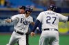 FILE - In this May 7, 2019, file photo, Tampa Bay Rays' Brandon Lowe, left, celebrates with third base coach Rodney Linares after hitting a home run off Arizona Diamondbacks pitcher Taylor Clarke during the first inning of a baseball game in St. Petersburg, Fla. They have a terrible stadium, hardly any fans and one of baseball's smallest payrolls. Yet, somehow, the Rays stay competitive year after year. It is one of the most compelling stories in sports, even if few people notice. (AP Photo/Chris O'Meara, File)