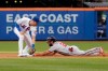 Washington Nationals' Adam Eaton, right, slides safely into second base against New York Mets second baseman Jeff McNeil during the first inning of a baseball game Saturday, Aug. 10, 2019, in New York. (AP Photo/Seth Wenig)