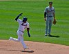 As Detroit Tigers first baseman Brandon Dixon, right, looks on, New York Mets' Adeiny Hechavarria reacts after hitting a three-run home run during the fourth inning of a baseball game at Citi Field, Sunday, May 26, 2019, in New York. (AP Photo/Seth Wenig)