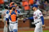 New York Mets catcher Tomas Nido, left, and relief pitcher Hector Santiago talk while heading to the dugout after the top of the 12th inning of a baseball game against the Detroit Tigers, Saturday, May 25, 2019, in New York. (AP Photo/Julio Cortez)