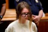 FILE - In this Oct. 30, 2018 file photo, Anna Sorokin appears in New York State Supreme Court on grand larceny charges. On Wednesday, March 27, 2019, Sorokin, the one-time darling of the Big Apple social scene is scheduled to stand trial on grand larceny and theft of services charges alleging she swindled $275,000 in a 10-month odyssey that saw her jetting to Omaha and Marrakesh. (AP Photo/Richard Drew, File)