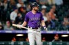 File-This May 25, 2019, file photo shows Colorado Rockies pinch-hitter Mark Reynolds reacting after striking out against Baltimore Orioles relief pitcher Josh Lucas during the ninth inning of a baseball game in Denver. Reynolds was cut by the Colorado Rockies Sunday, July 21, 2019, two home runs shy of 300 after hitting .170 with four homers and 20 RBIs in limited at-bats. He had just 135 at-bats in 78 games and was designated for assignment on Sunday in a flurry of roster moves by Colorado, which had lost 13 of its previous 15 games. A 13-year veteran, Reynolds said he will return home to assess whether or not he'd attempt to continue his playing career. (AP Photo/David Zalubowski, File)
