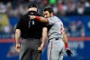 Washington Nationals' Adam Eaton, right, argues with first base umpire Mike Estabrook after a double play was turned during the top of the third inning of a baseball game against the New York Mets, Monday, May 20, 2019, in New York. (AP Photo/Sarah Stier)