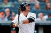 New York Yankees pinch hitter Mike Ford watches his ninth-inning, pinch-hit, walk off home run in a baseball game against the Oakland Athletics, Sunday, Sept. 1, 2019, in New York. The Yankees won the game 5-4. (AP Photo/Kathy Willens)