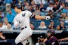 New York Yankees' Aaron Judge follows through on a single during the first inning of a baseball game against the Cleveland Indians, Friday, Aug. 16, 2019, in New York. (AP Photo/Frank Franklin II)