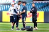 New York Yankees pitching coach Larry Rothschild, back left, watches as starting pitcher Luis Severino, second from left, gathers his belongings after a brief workout, Monday, Oct. 14, 2019, at Yankee Stadium in New York on an off day during the American League Championship Series against the Houston Astros. (AP Photo/Kathy Willens)