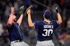 San Diego Padres relief pitcher Kirby Yates, left, and first baseman Eric Hosmer (30) react after defeating the New York Yankees 5-4 in a baseball game, Tuesday, May 28, 2019, in New York. (AP Photo/Julio Cortez)