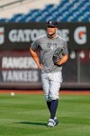 New York Yankees' Giancarlo Stanton, who has been out the much of the season with injuries and is still on the IL, stands in the outfield after a workout before the team's baseball game against the Texas Rangers, Wednesday, Sept. 4, 2019, in New York. (AP Photo/Kathy Willens)