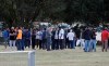 People wait for the start of funeral services in Christchurch, New Zealand, Wednesday, March 20, 2019. The first two burials of the victims from last week‚Äôs mosque shootings are scheduled to take place Wednesday morning. (AP Photo/Mark Baker)