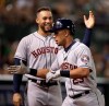 Houston Astros' Michael Brantley, right, is congratulated by George Springer after hitting a home run against the Oakland Athletics during the sixth inning of a baseball game Thursday, Aug. 15, 2019, in Oakland, Calif. (AP Photo/Ben Margot)