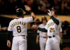 Oakland Athletics' Matt Chapman, right, celebrates with Robbie Grossman (8) after hitting a three-run home run off Los Angeles Angels' Jaime Barria during the third inning of a baseball game Tuesday, Sept. 3, 2019, in Oakland, Calif. (AP Photo/Ben Margot)