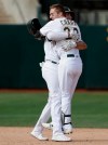 Oakland Athletics' Mark Canha, right, celebrates with Matt Olson after the Athletics defeated the Kansas City Royals 1-0 in 11 innings of a baseball game in Oakland, Calif., Wednesday, Sept. 18, 2019. Canha hit a double to score Jurickson Profar. (AP Photo/Jeff Chiu)