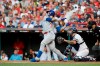 National League Javier Baez, of the Chicago Cubs, swings during the first inning of the MLB baseball All-Star Game against the American League, Tuesday, July 9, 2019, in Cleveland. (AP Photo/John Minchillo)