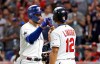 American League's Joey Gallo, left, of the Texas Rangers, is congratulated by American League teammate Francisco Lindor, of the Cleveland Indians, after Gallo hit a solo home run during the seventh inning of the MLB baseball All-Star Game, Tuesday, July 9, 2019, in Cleveland. (AP Photo/John Minchillo)