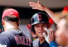 Cleveland Indians' Jake Bauers is congratulated in the dugout after hitting a two-run home run off Cincinnati Reds relief pitcher Jared Hughes during the fifth inning of a baseball game, Sunday, July 7, 2019, in Cincinnati. (AP Photo/Gary Landers)