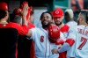 Cincinnati Reds' Phillip Ervin celebrates in the dugout after hitting a solo home run off Chicago Cubs relief pitcher Mike Montgomery during the second inning of a baseball game Friday, June 28, 2019, in Cincinnati. (AP Photo/John Minchillo)
