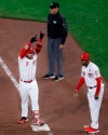 Cincinnati Reds' Eugenio Suarez (7) celebrates after hitting an RBI single off Chicago Cubs starting pitcher Jose Quintana during the fifth inning of a baseball game Thursday, May 16, 2019, in Cincinnati. (AP Photo/John Minchillo)