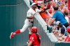 Cincinnati Reds' Yasiel Puig catches a foul ball hit by Los Angeles Dodgers' Hyun-Jin Ryu in the sixth inning of a baseball game, Sunday, May 19, 2019, in Cincinnati. (AP Photo/John Minchillo)
