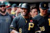 Pittsburgh Pirates' Starling Marte (6) celebrates in the dugout after hitting a two-run home run off Cincinnati Reds relief pitcher David Hernandez in the eighth inning during the first baseball game of a doubleheader, Monday, May 27, 2019, in Columbus. (AP Photo/John Minchillo)