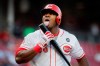 Cincinnati Reds' Yasiel Puig licks his bat after hitting a foul tip off Chicago Cubs starting pitcher Yu Darvish in the fourth inning of a baseball game, Wednesday, May 15, 2019, in Cincinnati. (AP Photo/John Minchillo)