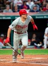 Philadelphia Phillies' J.T. Realmuto watches his RBI-double off Cleveland Indians starting pitcher Adam Plutko during the third inning of a baseball game in Cleveland, Sunday, Sept. 22, 2019. (AP Photo/Phil Long)