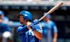 Kansas City Royals' Cheslor Cuthbert hits a one-run double in the first inning of a baseball game against the Cleveland Indians, Sunday, July 21, 2019, in Cleveland. Hunter Dozier scored on the play. (AP Photo/Tony Dejak)
