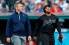 Cleveland Indians' Jose Ramirez, right, walks off the field with a trainer during the first inning of the team's baseball game against the Kansas City Royals, Saturday, Aug. 24, 2019, in Cleveland. (AP Photo/Tony Dejak)