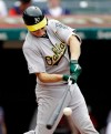 Oakland Athletics' Nick Hundley hits an one-run double off Cleveland Indians relief pitcher Tyler Clippard in the seventh inning of a baseball game, Wednesday, May 22, 2019, in Cleveland. Ramon Laureano scored on the play. (AP Photo/Tony Dejak)