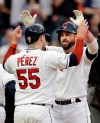 Cleveland Indians' Jason Kipnis, right, is congratulated by Roberto Perez after Kipnis hit a three-run home run off Baltimore Orioles starting pitcher Gabriel Ynoa in the fourth inning of a baseball game, Thursday, May 16, 2019, in Cleveland. Perez and Jordan Luplow scored on the play. (AP Photo/Tony Dejak)