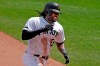 This May 23, 2019, file photo shows Pittsburgh Pirates' Josh Bell rounding third after hitting a solo home run off Colorado Rockies relief pitcher Carlos Estevez during the seventh inning of a baseball game in Pittsburgh.The first baseman is hitting home runs at a historic rate for the 138-year-old franchise thanks to an approach that's centered on consistency and not constant tinkering. (AP Photo/Gene J. Puskar/File)