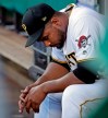 Pittsburgh Pirates relief pitcher Michael Feliz sits in the dugout after being removed from the team's baseball game after giving up a grand slam to Los Angeles Dodgers' David Freese during the first inning in Pittsburgh, Friday, May 24, 2019. (AP Photo/Gene J. Puskar)