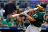 Oakland Athletics' Kendrys Morales drives in a run with a triple off Pittsburgh Pirates starting pitcher Trevor Williams during the first inning of a baseball game in Pittsburgh, Saturday, May 4, 2019. (AP Photo/Gene J. Puskar)