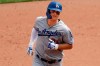 Los Angeles Dodgers' Joc Pederson rounds second base after hitting a solo home run off Pittsburgh Pirates starting pitcher Chris Archer during the sixth inning of a baseball game in Pittsburgh, Sunday, May 26, 2019. (AP Photo/Gene J. Puskar)