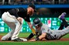 Pittsburgh Pirates third baseman Colin Moran tags out Colorado Rockies' Brendan Rodgers after taking the pickoff throw from catcher Elias Diaz during the fifth inning of a baseball game in Pittsburgh, Wednesday, May 22, 2019. (AP Photo/Gene J. Puskar)