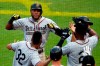 Pittsburgh Pirates' Starling Marte, top left, is greeted as he returns to the dugout after hitting a three-run home run off Milwaukee Brewers relief pitcher Josh Hader during the eighth inning of a baseball game in Pittsburgh, Saturday, June 1, 2019. (AP Photo/Gene J. Puskar)
