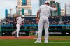 Cincinnati Reds' Aristides Aquino, left, celebrates with third base coach J.R. House as he rounds third after hitting a solo home run during the second inning of a baseball game, Friday, Aug. 23, 2019, in Pittsburgh. (AP Photo/Keith Srakocic)