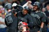 Pittsburgh Pirates' Colin Moran, left, is greeted by teammates Starling Marte, top center, Josh Bell, right, and Jose Osuna (obscured), rear, after a grand slam in the sixth inning of a baseball game against the Cincinnati Reds, Saturday, Aug. 24, 2019, in Pittsburgh. (AP Photo/Keith Srakocic)