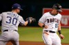 Arizona Diamondbacks' Tim Locastro (16) gets safely back to first base as San Diego Padres first baseman Eric Hosmer (30) applies a late tag on a pickoff-attempt during the first inning of a baseball game Friday, Sept. 27, 2019, in Phoenix. (AP Photo/Ross D. Franklin)