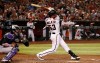 Arizona Diamondbacks' Christian Walker (53) follows through on a three-run home run swing as Colorado Rockies catcher Tony Wolters, left, looks on during the fifth inning of a baseball game Friday, July 5, 2019, in Phoenix. (AP Photo/Ross D. Franklin)