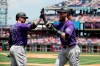 Colorado Rockies' Charlie Blackmon, right, celebrates his home run off of Philadelphia Phillies starting pitcher Jerad Eickhoff with Trevor Story during the first inning of a baseball game Sunday, May 19, 2019, in Philadelphia. (AP Photo/Matt Rourke)