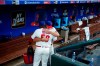 Philadelphia Phillies' Gabe Kapler, right, hugs relief pitcher Hector Neris after a baseball game against the Miami Marlins, Sunday, Sept. 29, 2019, in Philadelphia. (AP Photo/Matt Slocum)