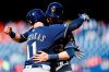 Milwaukee Brewers' Mike Moustakas, left, and Christian Yelich celebrate after Moustakas' two-run home run off Philadelphia Phillies relief pitcher Austin Davis during the ninth inning of a baseball game, Thursday, May 16, 2019, in Philadelphia. Milwaukee won 11-3. (AP Photo/Matt Slocum)