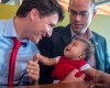 Liberal leader Justin Trudeau greets a young patron while campaigning at a restaurant Friday, October 4, 2019 in Quebec City.THE CANADIAN PRESS/Ryan Remiorz
