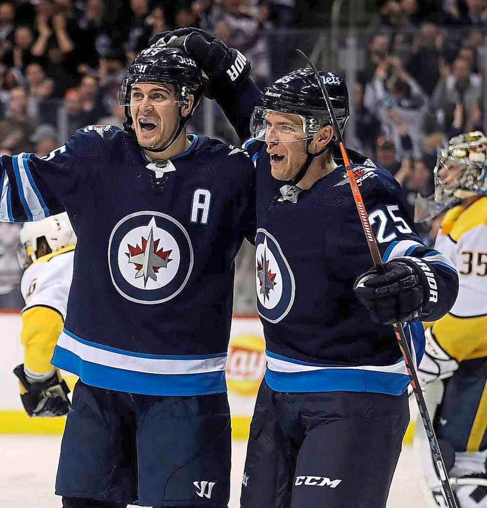THE CANADIAN PRESS/Trevor Hagan
Mark Scheifele, left, and Paul Stastny celebrate a goal on Nashville Predators. Stastny signed a three-year, $19.5-million contract with the Vegas Golden Knights after his playoff run with the Jets was over.