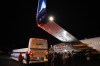 Members of the media inspect the wing from Liberal Leader Justin Trudeau's campaign plane after being struck by the media bus following landing in Victoria, B.C., on Wednesday, Sept.11, 2019. THE CANADIAN PRESS/Sean Kilpatrick