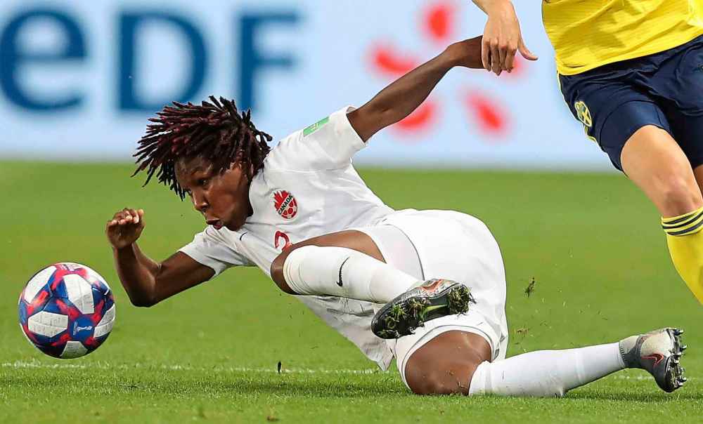 AP Photo/Francisco Seco
Canada's Kadeisha Buchanan, left, falls after challenging during the Women's World Cup against Sweden Monday.