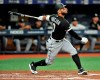 Chicago White Sox's Yoan Moncada hits a RBI-double off Tampa Bay Rays starter Brendan McKay during the second inning of a baseball game Friday, July 19, 2019, in St. Petersburg, Fla. (AP Photo/Steve Nesius)